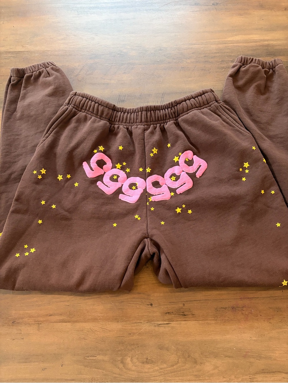 Brown Sp5der Sweatpants with Pink & Yellow Star Graphic